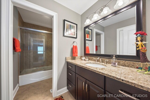 2793 Nicole Cir, Aurora, IL 60502 - full bathroom with baseboards, tile patterned flooring, vanity, and shower / bath combination with glass door