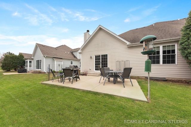 2793 Nicole Cir, Aurora, IL 60502 - back of property with a patio, a yard, and a chimney