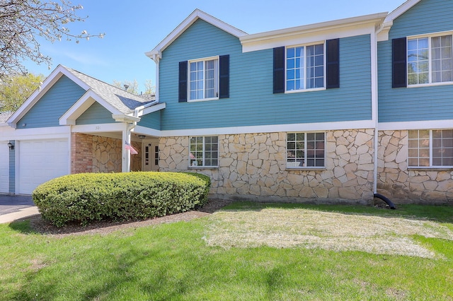 301 Memory Ln Unit 3C, Westmont, IL 60559 - view of front of house with stone siding, a garage, and a front lawn