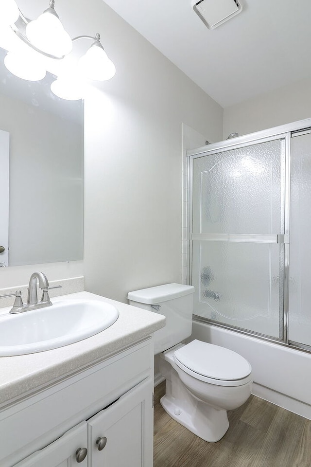 301 Memory Ln Unit 3C, Westmont, IL 60559 - full bath featuring toilet, wood finished floors, vanity, and combined bath / shower with glass door