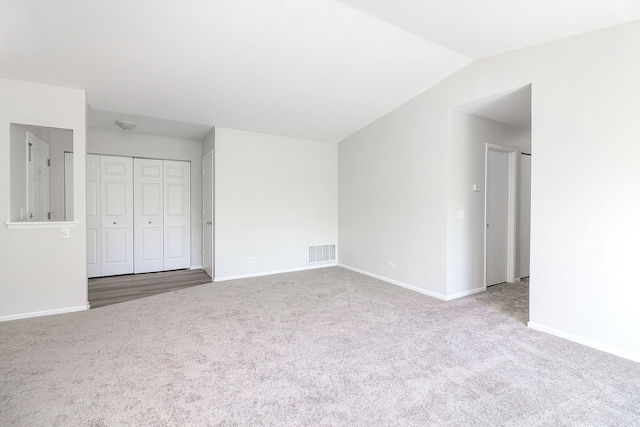 301 Memory Ln Unit 3C, Westmont, IL 60559 - unfurnished bedroom featuring carpet floors, baseboards, lofted ceiling, and a closet