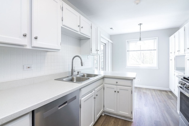 301 Memory Ln Unit 3C, Westmont, IL 60559 - kitchen with appliances with stainless steel finishes, a sink, white cabinetry, backsplash, and light countertops