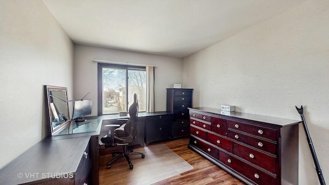 home office with wood finished floors