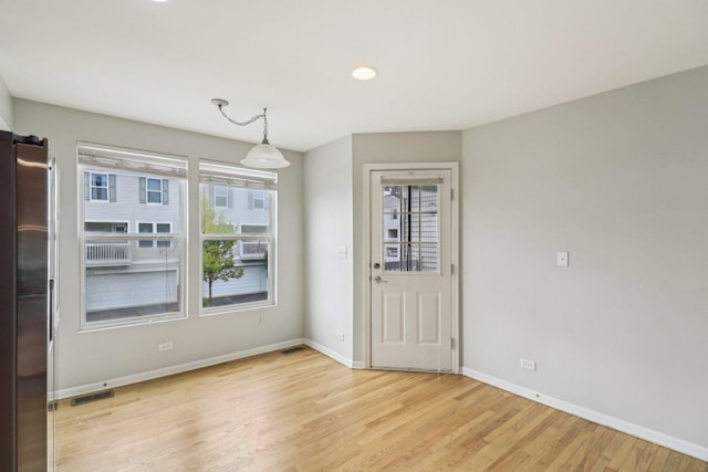 2303 Neubauer Cir, Lindenhurst, IL 60046 - entryway with light wood-style flooring, baseboards, and plenty of natural light