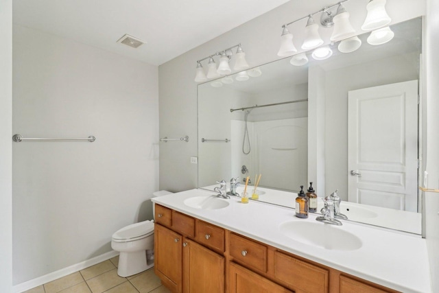 2303 Neubauer Cir, Lindenhurst, IL 60046 - full bath featuring tile patterned flooring, a shower, toilet, double vanity, and baseboards