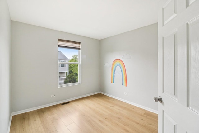 2303 Neubauer Cir, Lindenhurst, IL 60046 - spare room with light wood-style floors and baseboards