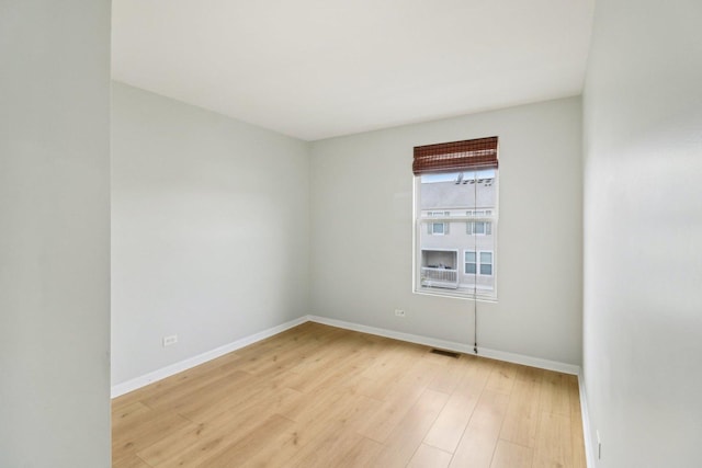 2303 Neubauer Cir, Lindenhurst, IL 60046 - unfurnished room featuring light wood-style floors and baseboards