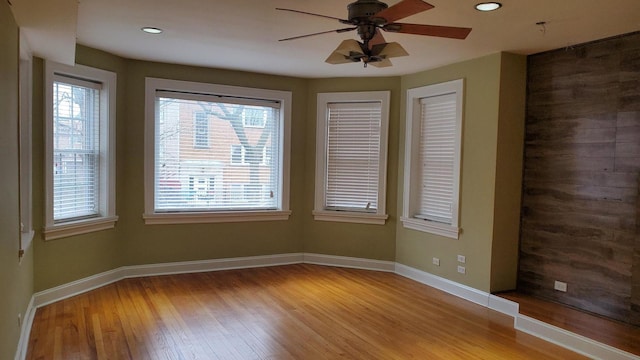 6147 N Mozart St Unit 3, Chicago, IL 60659 - spare room featuring wood finished floors, plenty of natural light, baseboards, and recessed lighting