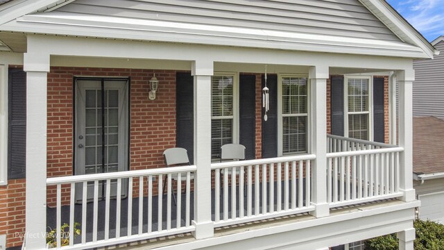 1704 Walnut Park Ln, Aurora, IL 60504 - view of side of home with brick siding and covered porch