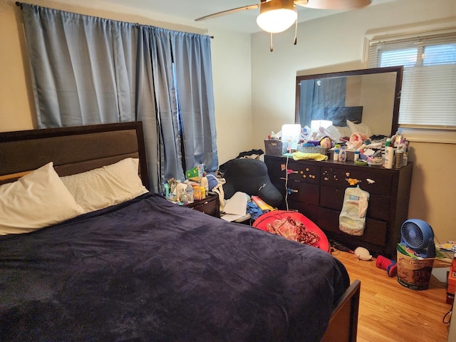 bedroom featuring wood finished floors and ceiling fan