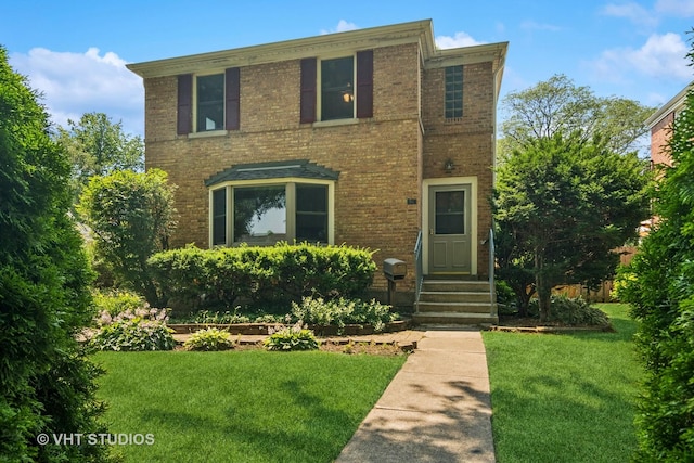 212 N Russel St, Mount Prospect, IL 60056 - view of front of house featuring a front lawn, brick siding, and entry steps