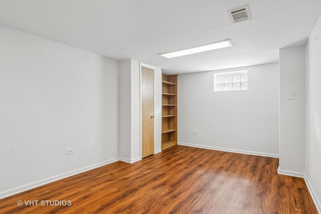 212 N Russel St, Mount Prospect, IL 60056 - below grade area featuring wood finished floors and baseboards