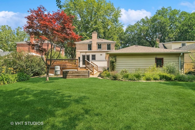 212 N Russel St, Mount Prospect, IL 60056 - rear view of property with a deck, a yard, and a chimney