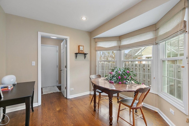 dining area featuring recessed lighting, baseboards, and wood finished floors