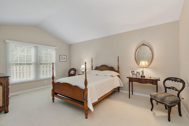 bedroom featuring baseboards, vaulted ceiling, and light colored carpet