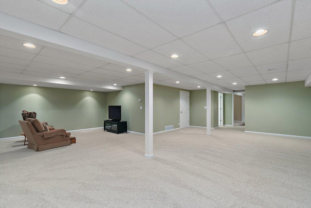 finished below grade area with baseboards, visible vents, and recessed lighting