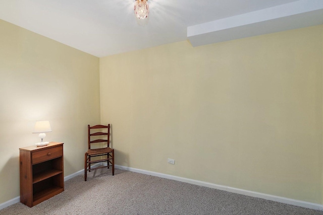 living area with light colored carpet and baseboards