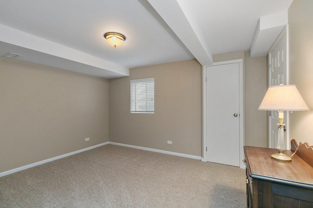 interior space featuring baseboards and carpet