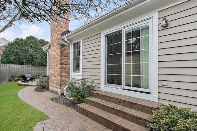 view of patio featuring fence and entry steps