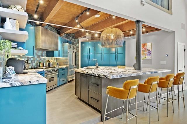 kitchen with premium appliances, backsplash, wood ceiling, a sink, and custom exhaust hood