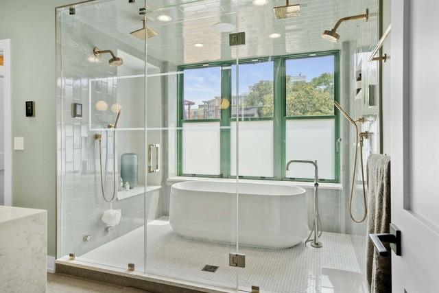 bathroom featuring a soaking tub and a stall shower