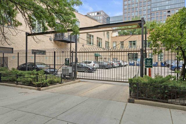 view of gate featuring fence