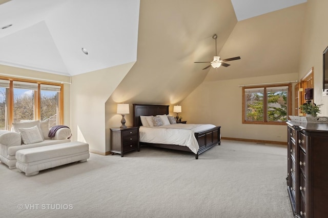 bedroom featuring baseboards, high vaulted ceiling, and multiple windows
