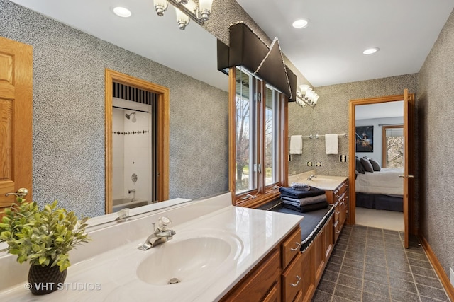 ensuite bathroom with plenty of natural light, ensuite bath, recessed lighting, and vanity