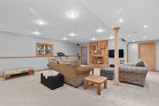 living area with light carpet, a brick fireplace, baseboards, and recessed lighting
