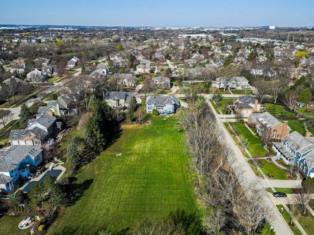 birds eye view of property with a residential view