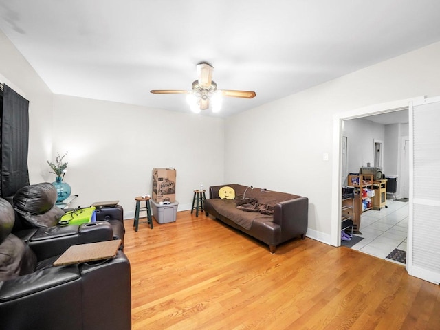 2124 W 24th St, Chicago, IL 60608 - living area with baseboards, ceiling fan, and light wood finished floors