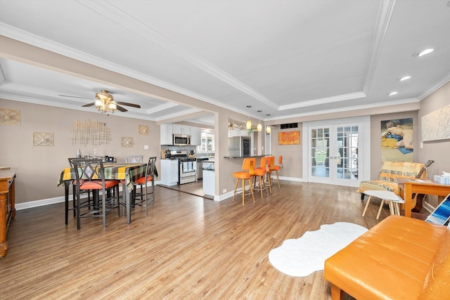 472 Lakewood Blvd, Park Forest, IL 60466 - living room with plenty of natural light, light wood-style flooring, french doors, and a raised ceiling