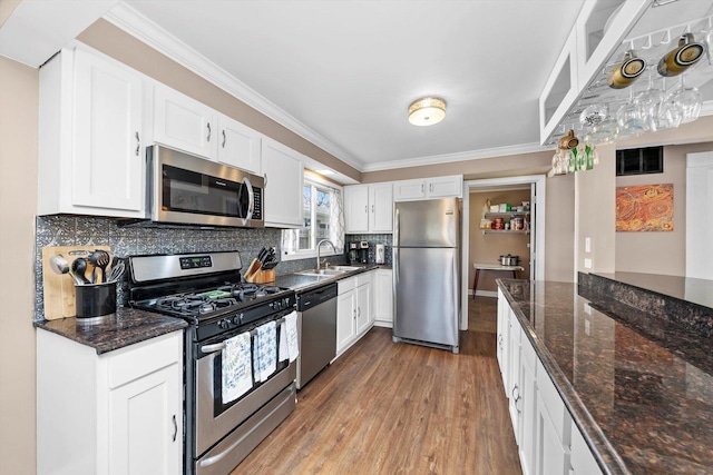 472 Lakewood Blvd, Park Forest, IL 60466 - kitchen with white cabinetry, light wood finished floors, stainless steel appliances, and a sink