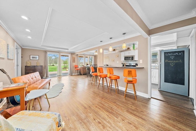 472 Lakewood Blvd, Park Forest, IL 60466 - living room featuring a ceiling fan, crown molding, light wood-style flooring, a raised ceiling, and recessed lighting
