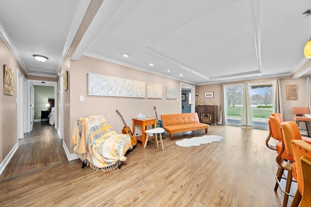 472 Lakewood Blvd, Park Forest, IL 60466 - living room featuring wood finished floors, a raised ceiling, baseboards, ornamental molding, and recessed lighting