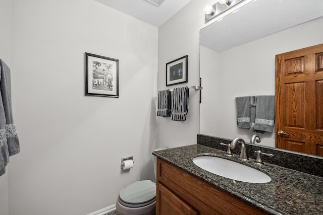 half bath with vanity and toilet