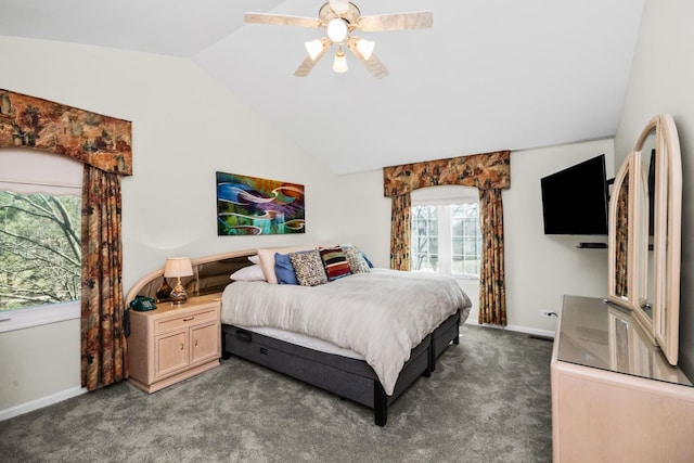carpeted bedroom with vaulted ceiling, baseboards, and ceiling fan