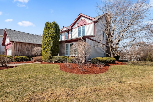 view of side of home featuring brick siding, a yard, and a garage