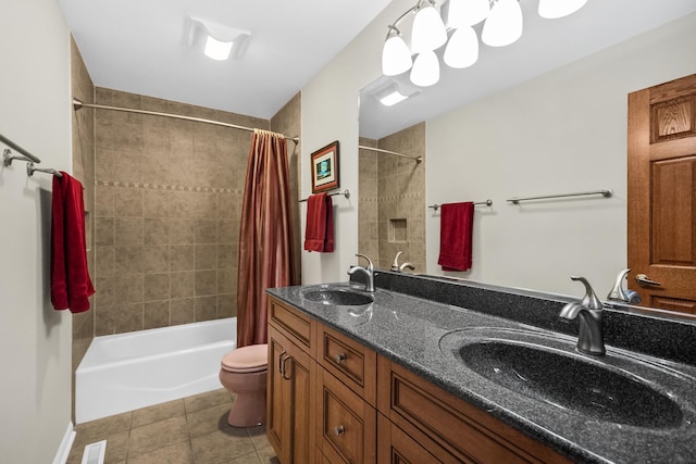 bathroom with tile patterned floors, shower / bath combo, a sink, and toilet