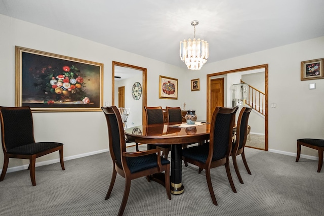 carpeted dining space featuring baseboards and a chandelier
