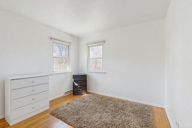 1S550 Hawthorne Ln, Wheaton, IL 60189 - unfurnished bedroom featuring baseboards, visible vents, and light wood-style flooring