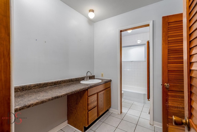 full bath featuring tile patterned floors, vanity, and baseboards
