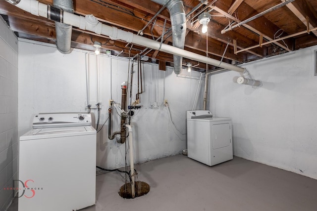 unfinished below grade area featuring separate washer and dryer