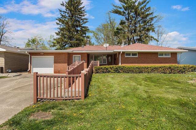 single story home with a garage, brick siding, a front lawn, and driveway