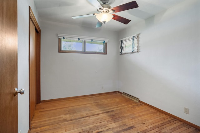 unfurnished bedroom with a closet, light wood-type flooring, ceiling fan, baseboards, and visible vents
