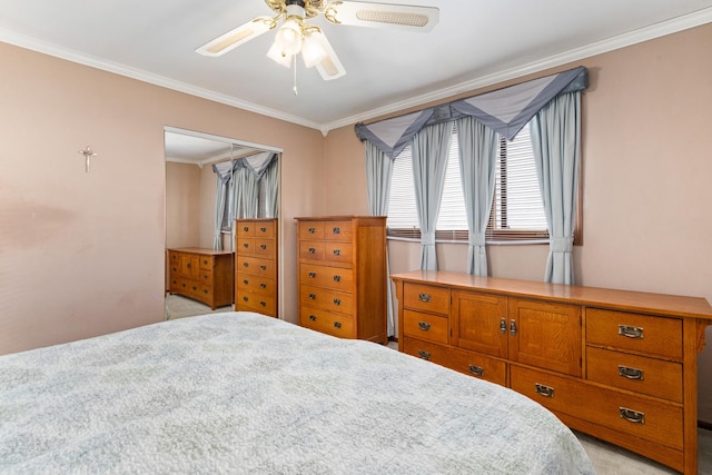 8900 W 169th Pl, Orland Hills, IL 60487 - bedroom with ornamental molding, light colored carpet, ceiling fan, and a closet