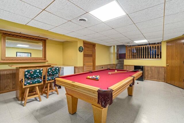 8900 W 169th Pl, Orland Hills, IL 60487 - playroom featuring wainscoting, tile patterned floors, wood walls, a dry bar, and a drop ceiling