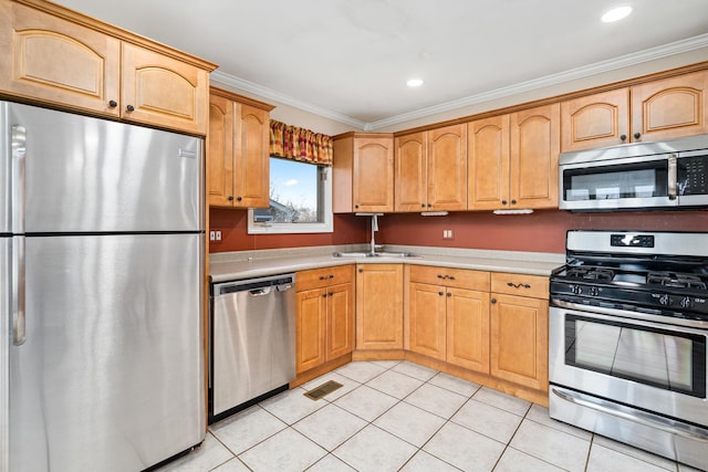 8900 W 169th Pl, Orland Hills, IL 60487 - kitchen with appliances with stainless steel finishes, a sink, light countertops, ornamental molding, and light tile patterned floors