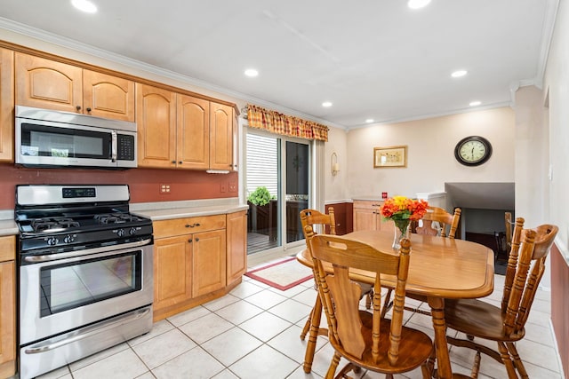 8900 W 169th Pl, Orland Hills, IL 60487 - kitchen with stainless steel appliances, crown molding, light countertops, light tile patterned floors, and recessed lighting