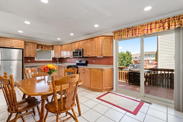 8900 W 169th Pl, Orland Hills, IL 60487 - kitchen featuring appliances with stainless steel finishes, crown molding, recessed lighting, light countertops, and light tile patterned floors